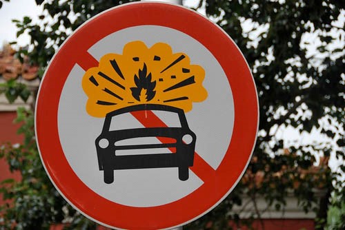 Figure 5. Photo of a road sign with a car on fire in Beijing, China.