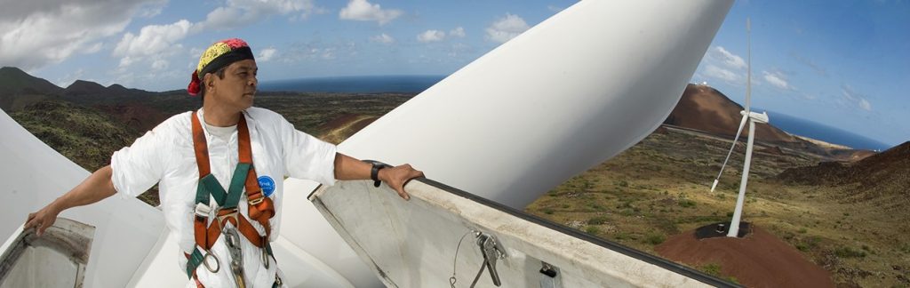 Worker atop a wind turbine