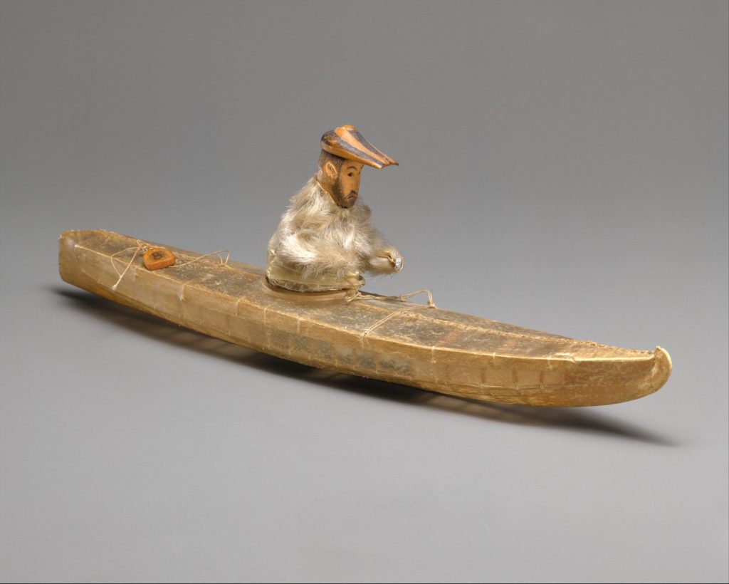 Aleut model of historic vessel and hunter circa 1840s or 1850s