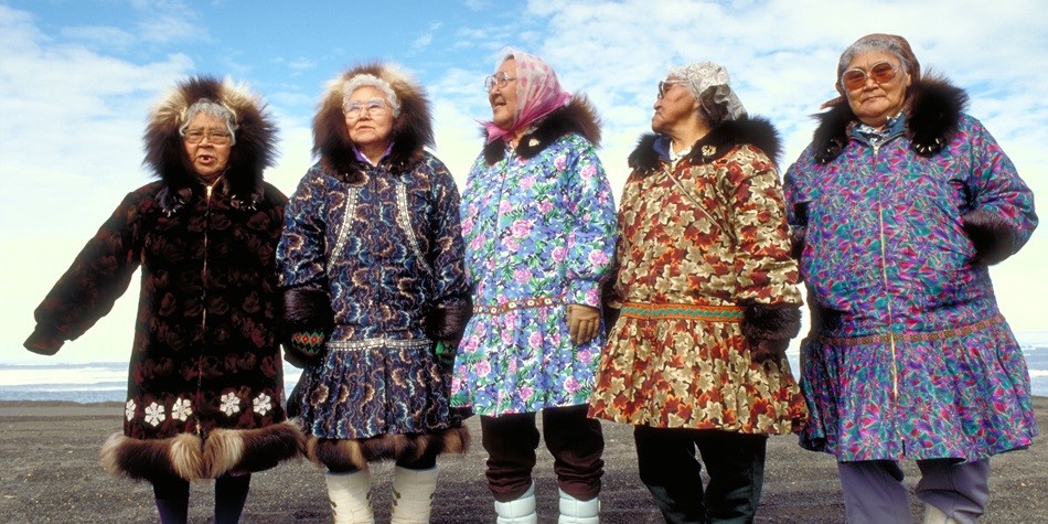 Native Alaskan women in traditional coats