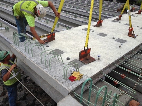 Figure 1. A prefabricated deck being placed on bridge girders