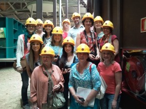 Women factory workers wearing hard hats