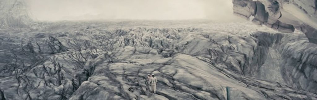 Astronauts on planet landscape