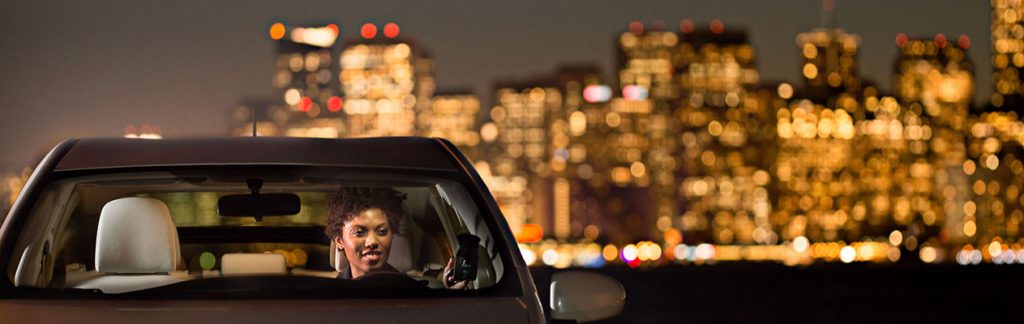 Woman in car at night