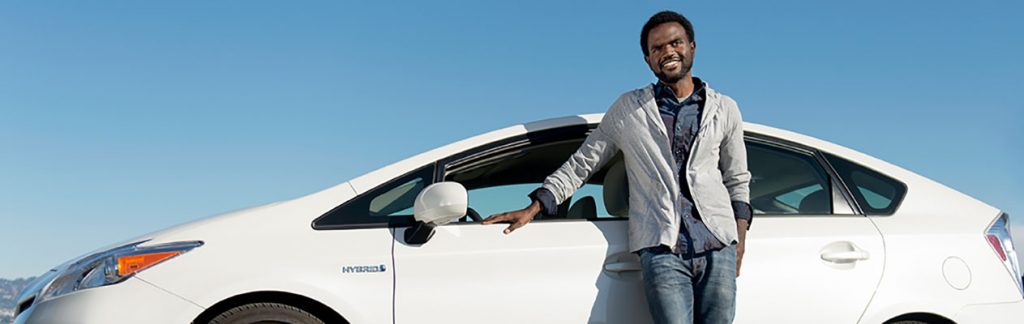 Man standing next to car