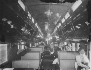 Inside a passenger rail car in the early 1900s