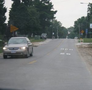 On-pavement speed limit signing on E-18 in Roland, Iowa