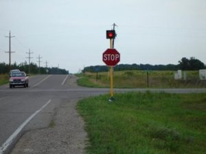 Use of overhead flashing beacons in addition to stop signs at all-way stop
